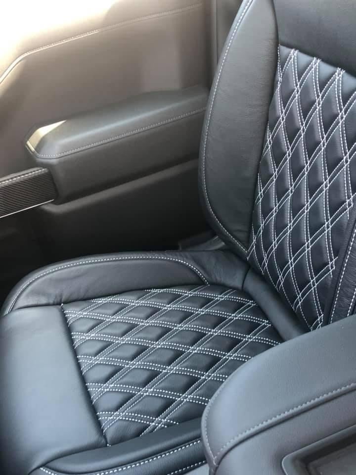 Custom seating in an American Luxury Coach Chevrolet Silverado